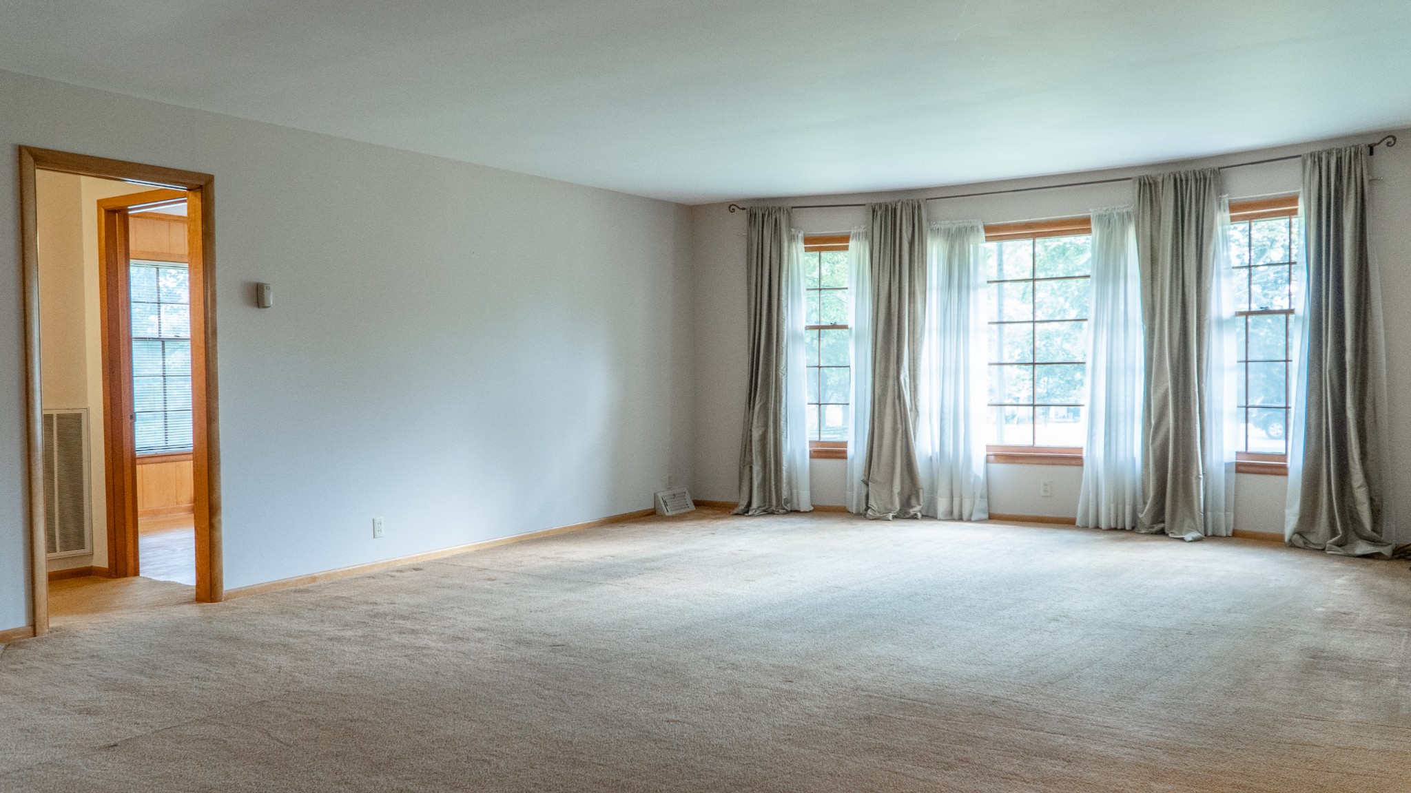 809 Berwick Trail Madison, TN 37115 - Photo 11 of 34 a view of a big room with windows and chandelier fan