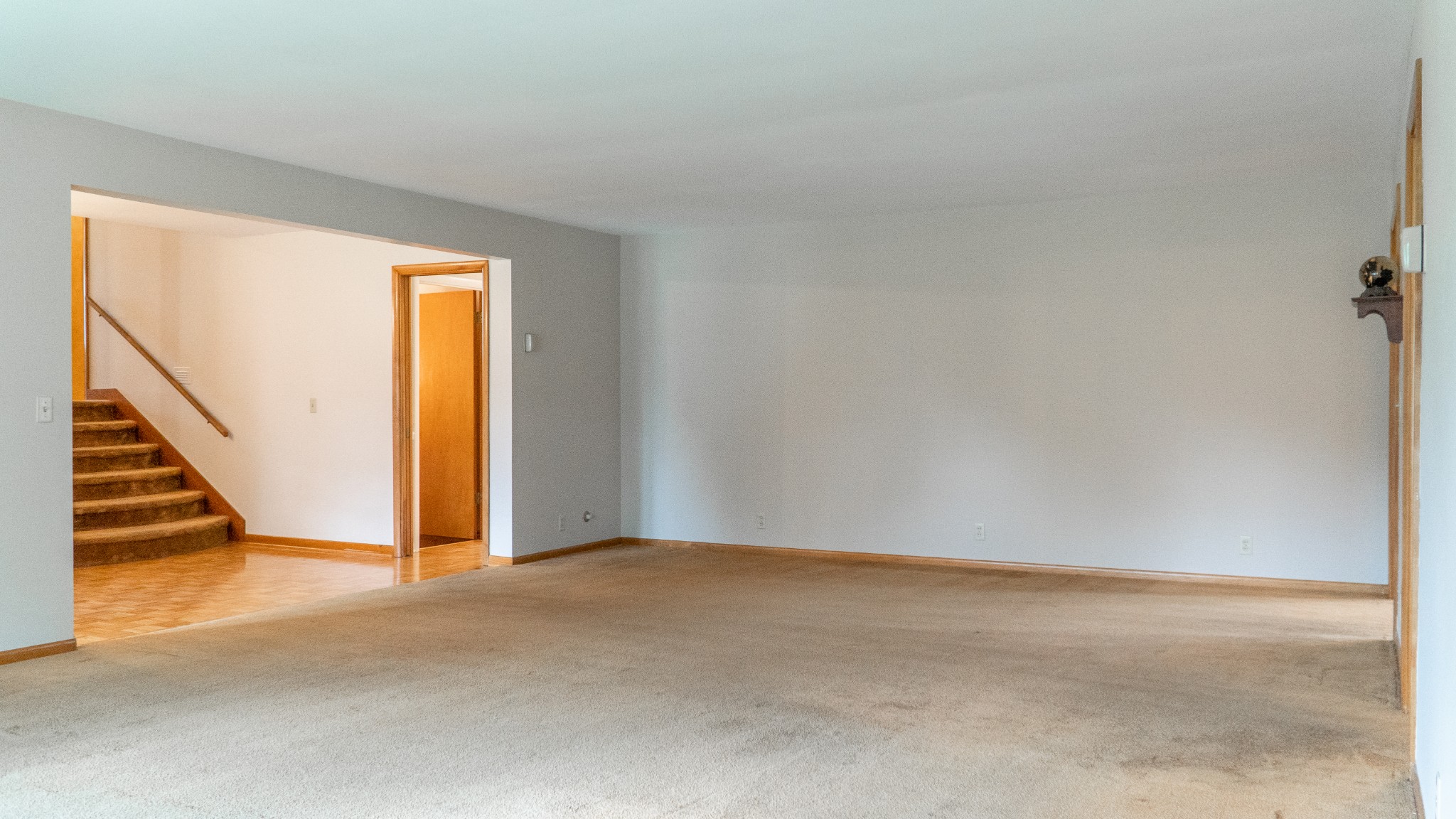 809 Berwick Trail Madison, TN 37115 - Photo 14 of 34 a view of an empty room with wooden floor and stairs