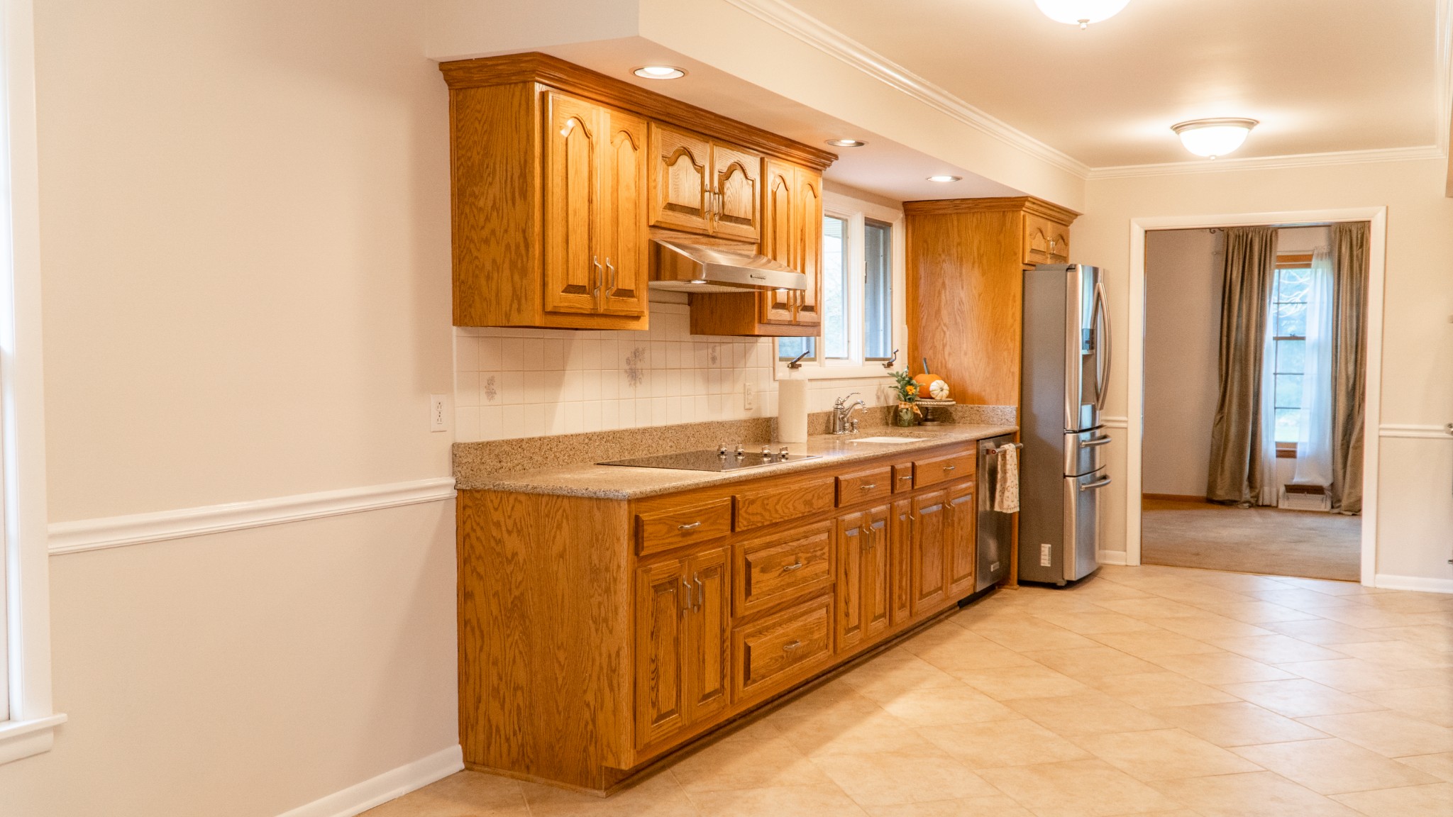 809 Berwick Trail Madison, TN 37115 - Photo 19 of 34 a kitchen with stainless steel appliances granite countertop a sink and a refrigerator