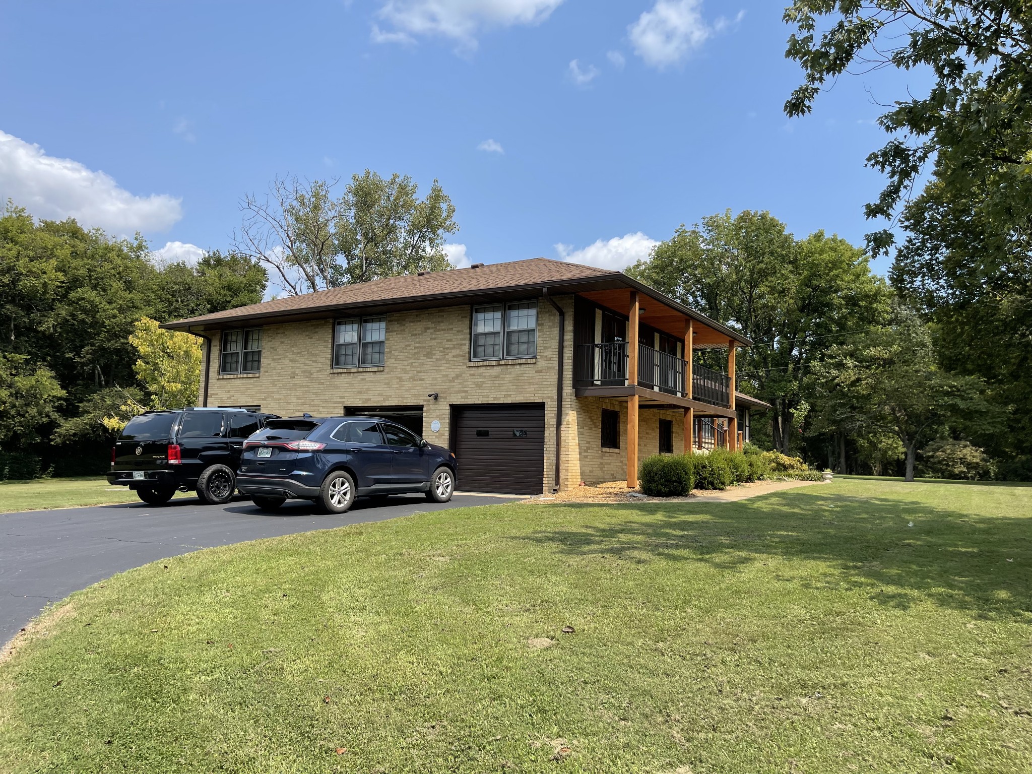 809 Berwick Trail Madison, TN 37115 - Photo 3 of 34 a view of a house with a big yard and potted plants