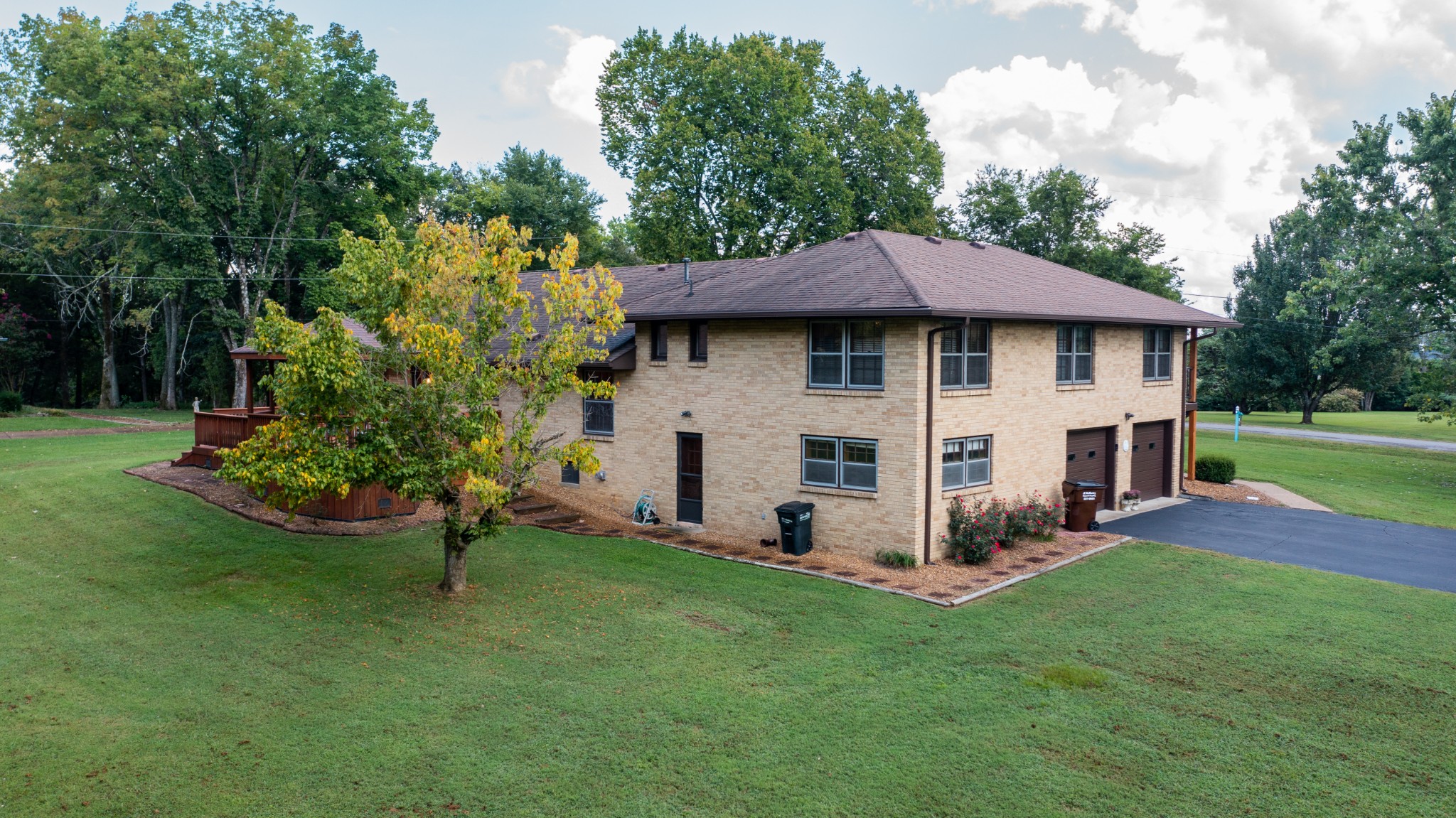 809 Berwick Trail Madison, TN 37115 - Photo 7 of 34 a view of a white house with a yard and sitting area