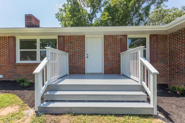 a view of house with stairs and wooden floor