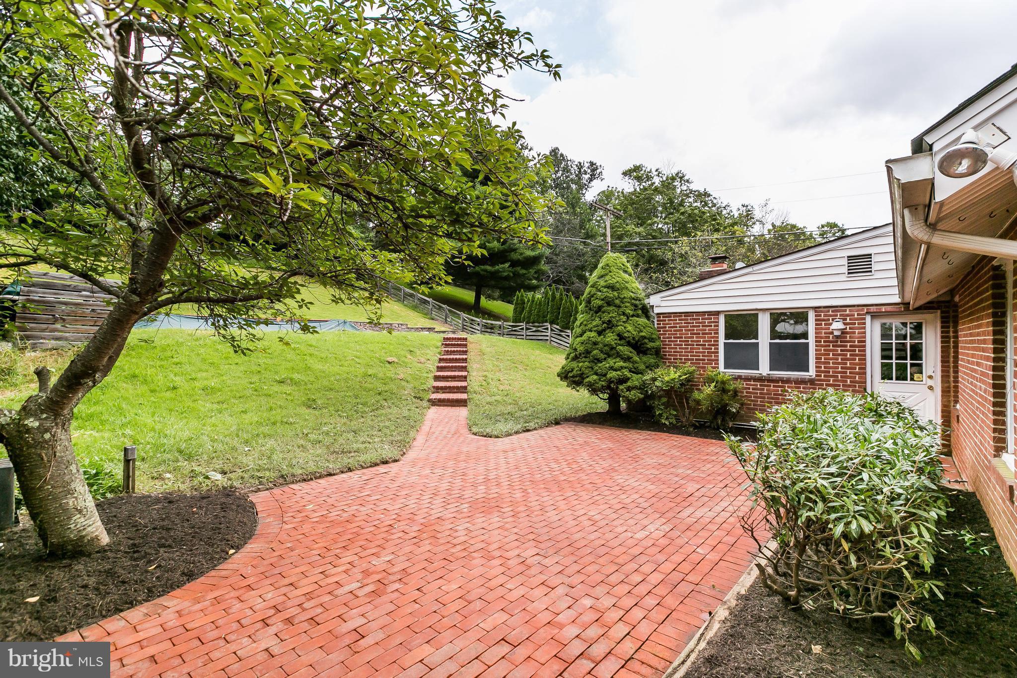1804 Roland Avenue Towson, MD 21204 - Photo 22 of 30 Large brick patio accessed from den