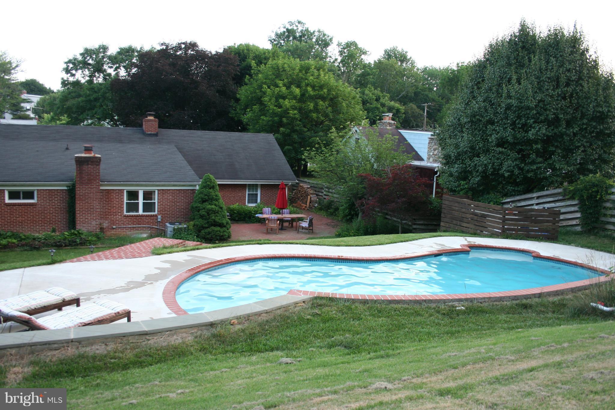 1804 Roland Avenue Towson, MD 21204 - Photo 25 of 30 Large pool with extensive hardscaping