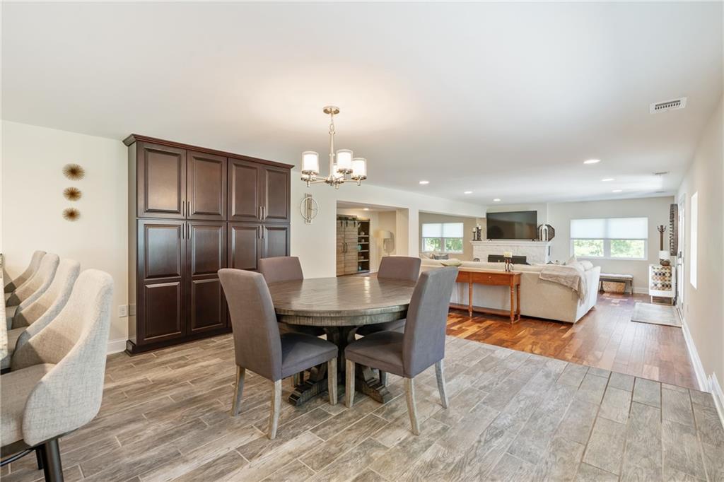 124 McBride Hill Road Butler, PA 16002 - Photo 19 of 41 a dining room with furniture and wooden floor