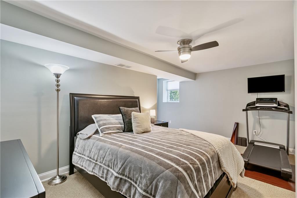 124 McBride Hill Road Butler, PA 16002 - Photo 32 of 41 a bedroom with a large bed and a tv