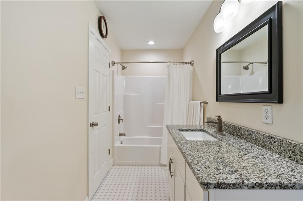 124 McBride Hill Road Butler, PA 16002 - Photo 40 of 41 a bathroom with a granite countertop sink and a mirror
