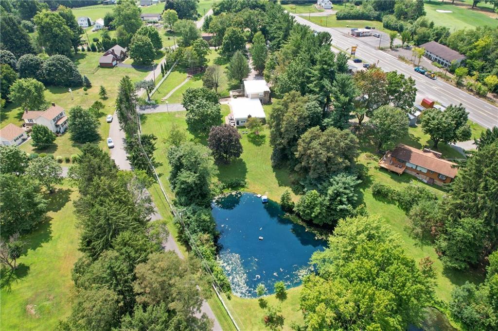 124 McBride Hill Road Butler, PA 16002 - Photo 7 of 41 an aerial view of residential house with swimming pool and green space
