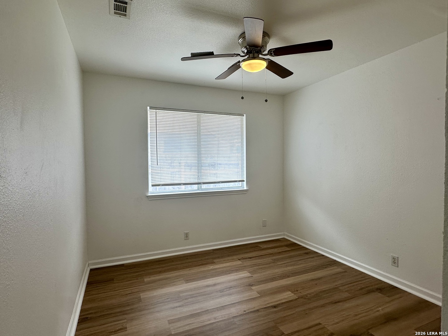 2012 Balsam Way Round Rock, TX 78665 - Photo 13 of 20 an empty room with wooden floor and windows
