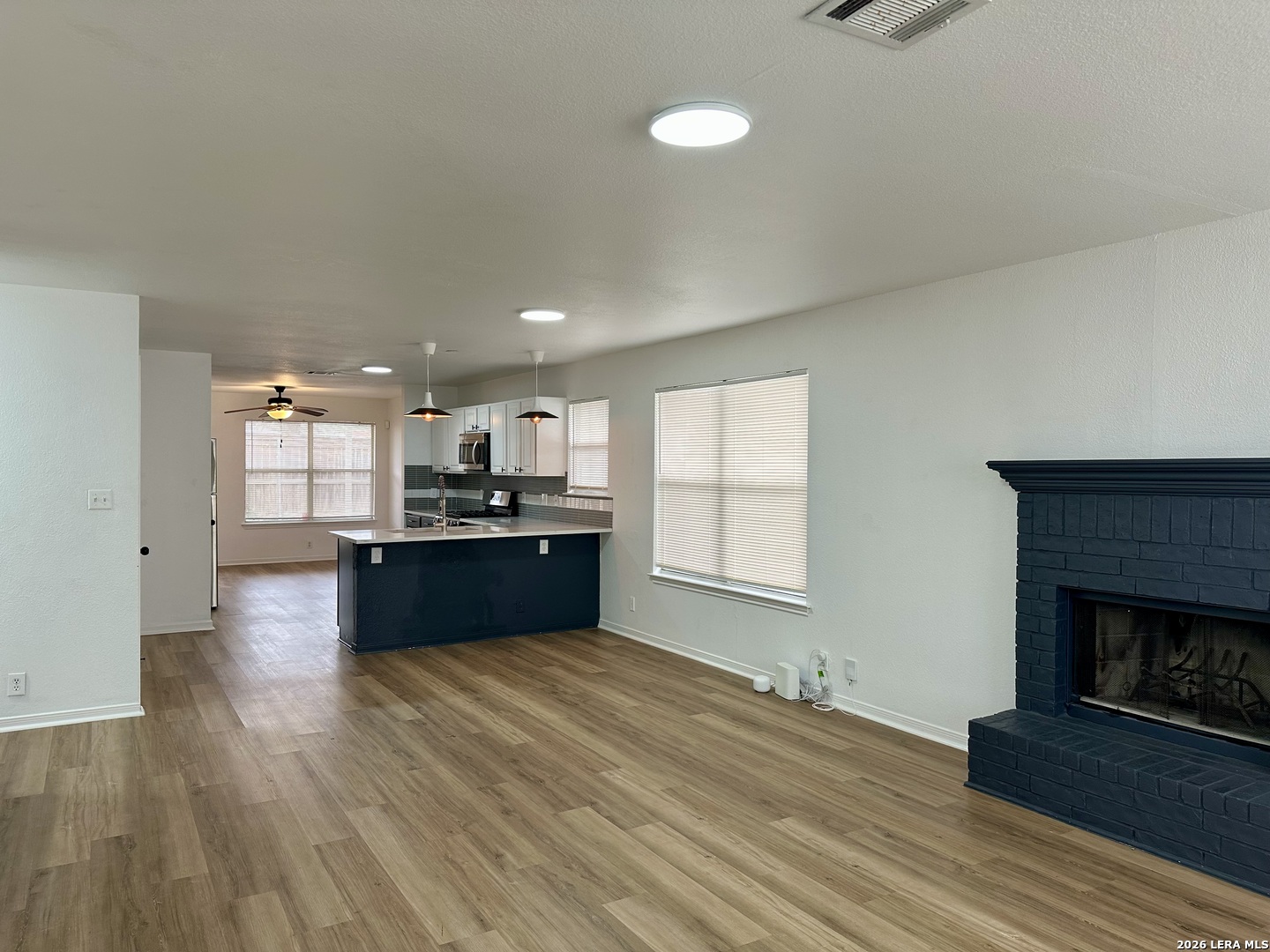 2012 Balsam Way Round Rock, TX 78665 - Photo 2 of 20 a kitchen with a refrigerator and a stove top oven