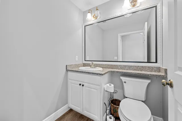 a view of a room with wooden floor and window