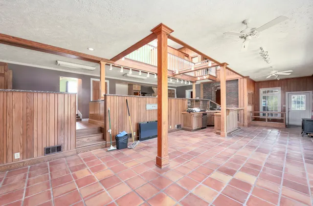 a view of a room with wooden ceiling