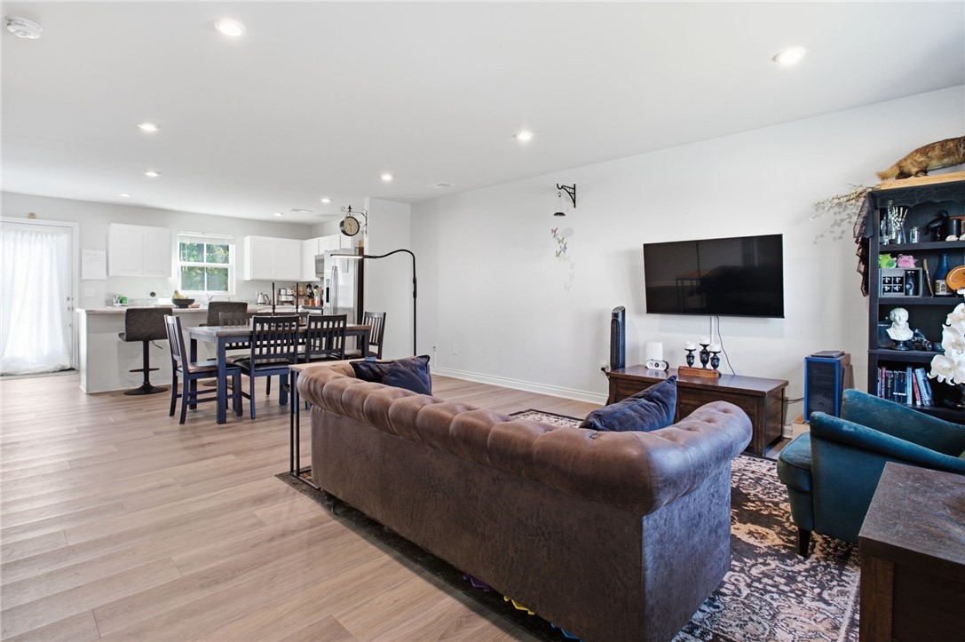 112 Wls Sta Road Seneca, SC 29678 - Photo 6 of 42 Smooth LVP flooring and recessed lighting define this versatile open concept living space.