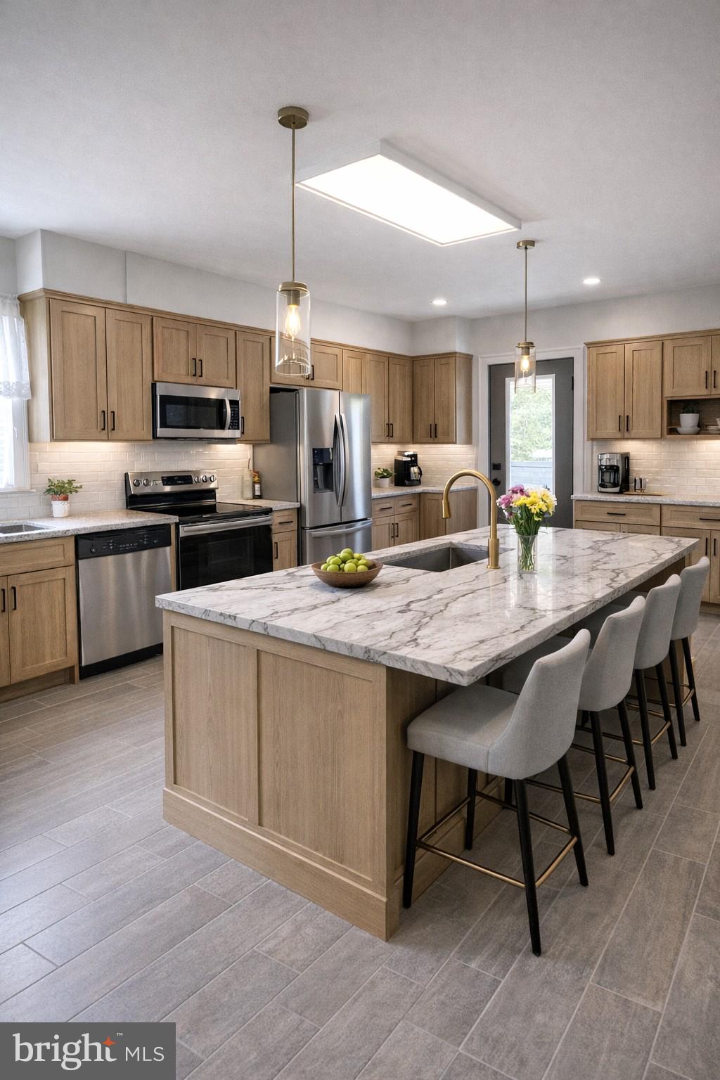 7514 Culp Street Philadelphia, PA 19128 - Photo 14 of 14 a kitchen with kitchen island granite countertop a stove top oven a sink dishwasher a dining table and chairs with wooden floor