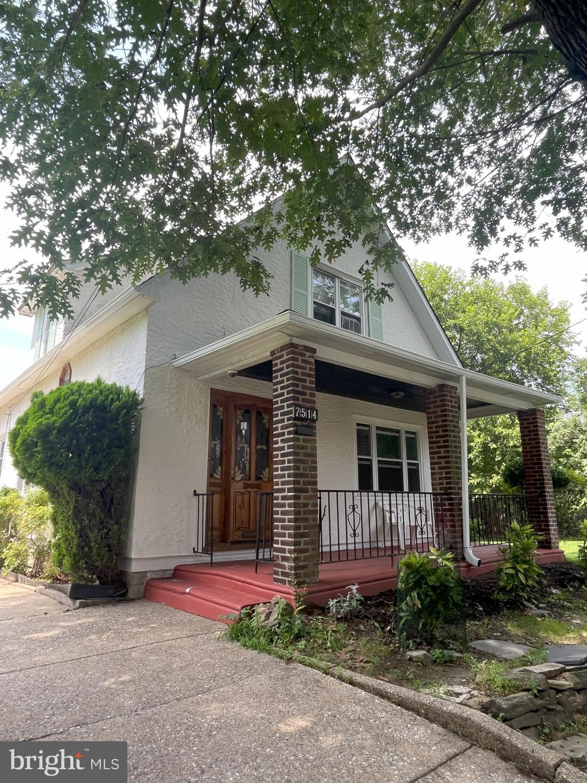 7514 Culp Street Philadelphia, PA 19128 - Photo 2 of 14 a front view of a house with garden