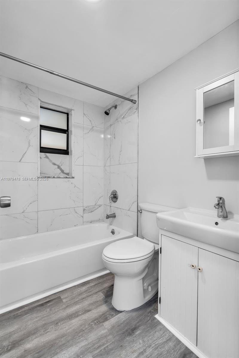 130 Southwest 31st Court, Unit 1 Miami, FL 33135 - Photo 16 of 17 a bathroom with a sink toilet and bathtub