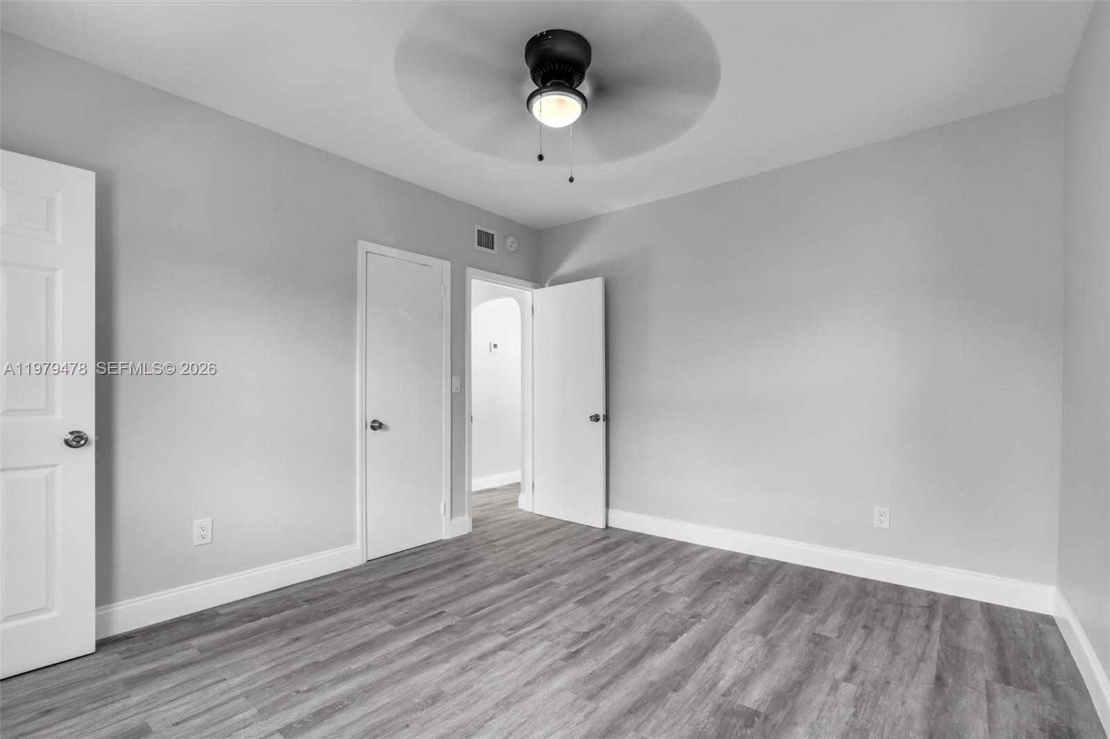 130 Southwest 31st Court, Unit 1 Miami, FL 33135 - Photo 17 of 17 a view of an empty room and wooden floor