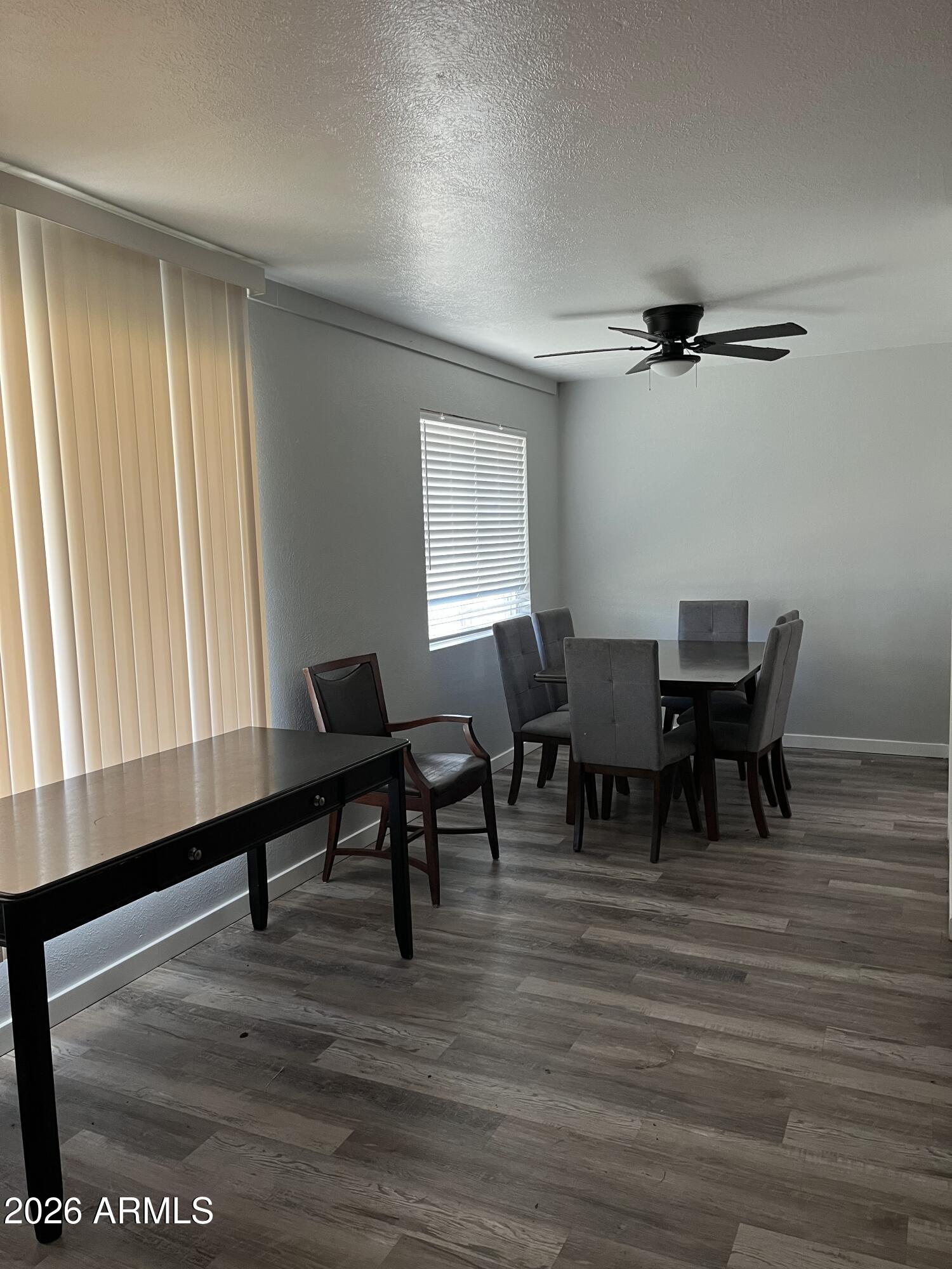 a dining room with furniture and window