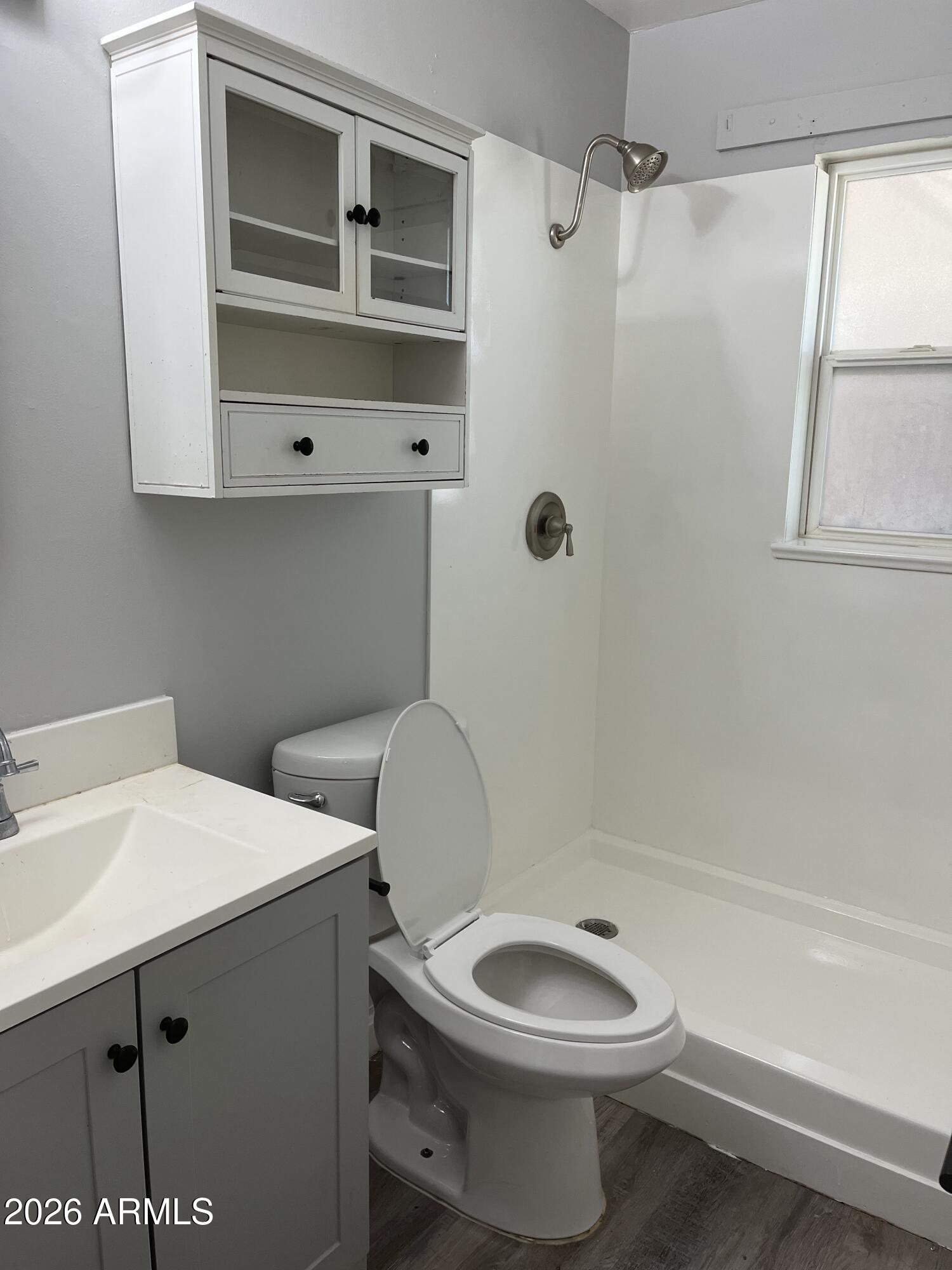 402 North 48th Street Phoenix, AZ 85008 - Photo 10 of 12 a bathroom with a sink a toilet and shower
