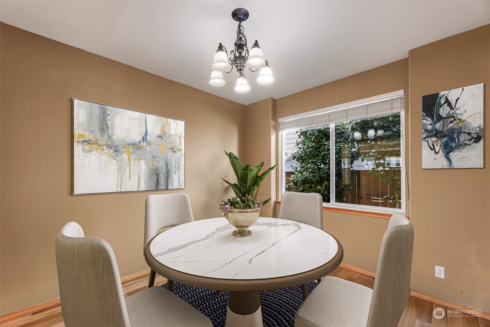 5907 Southeast 2nd Street Renton, WA 98059 - Photo 18 of 40 a dining room with furniture a large window and wooden floor