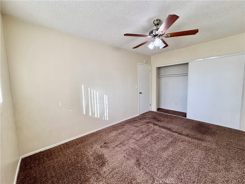 144 West Baseline Road, Unit 7 San Dimas, CA 91773 - Photo 10 of 11 a view of a hallway with a ceiling fan