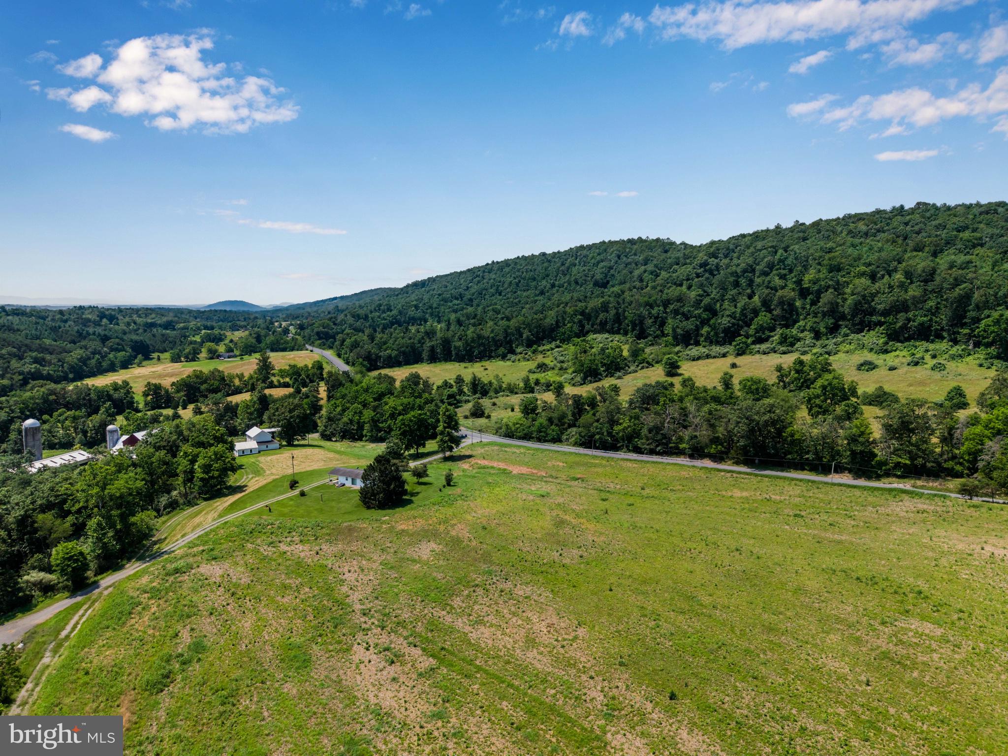 7296 Thompson Road Needmore, PA 17238 - Photo 7 of 40 Expansive green hills under blue skies.