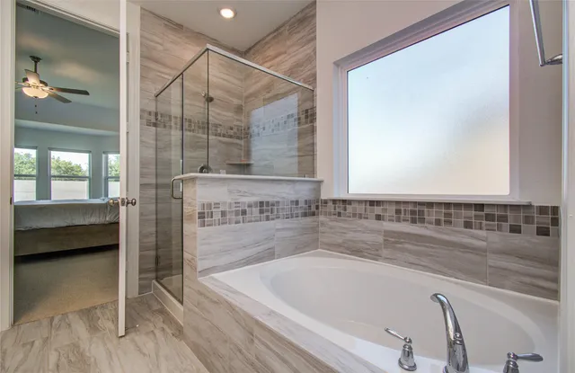 a bathroom with a bathtub and a sink