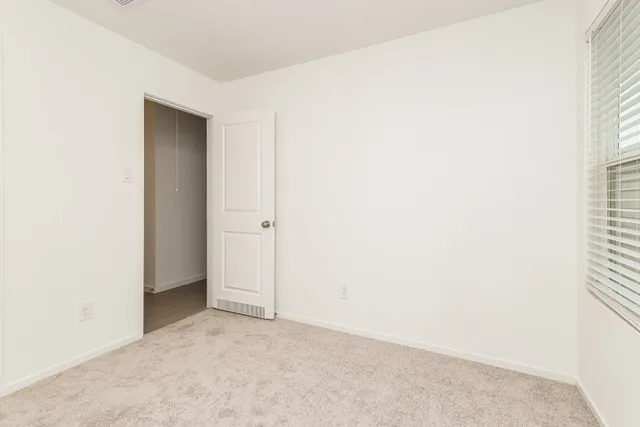 a bathroom with a toilet a sink and a mirror