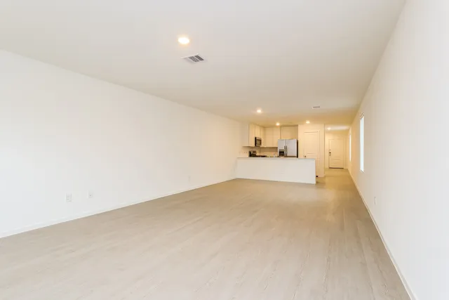 a view of a kitchen with a sink and a window