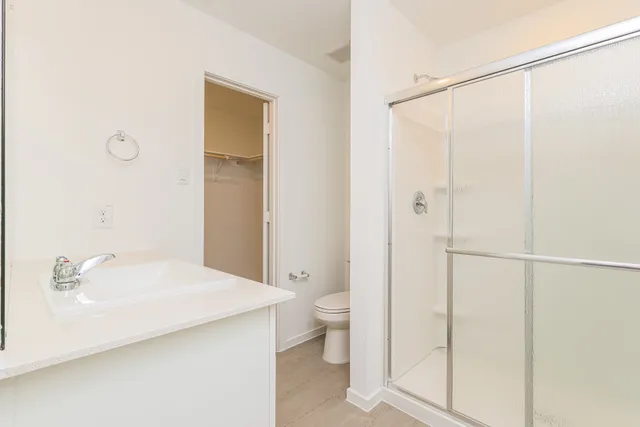 a bathroom with a shower and a toilet