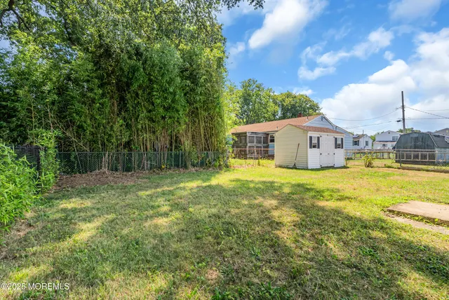 a house view with swimming pool in front of it