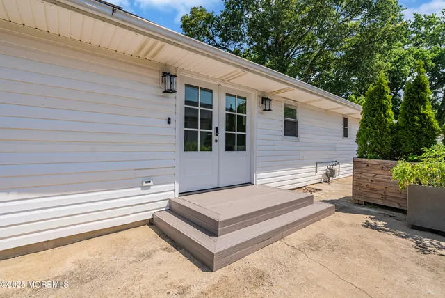 a view of a bench in front of house