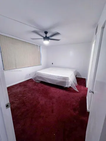 a bedroom with a bed and a cabinets