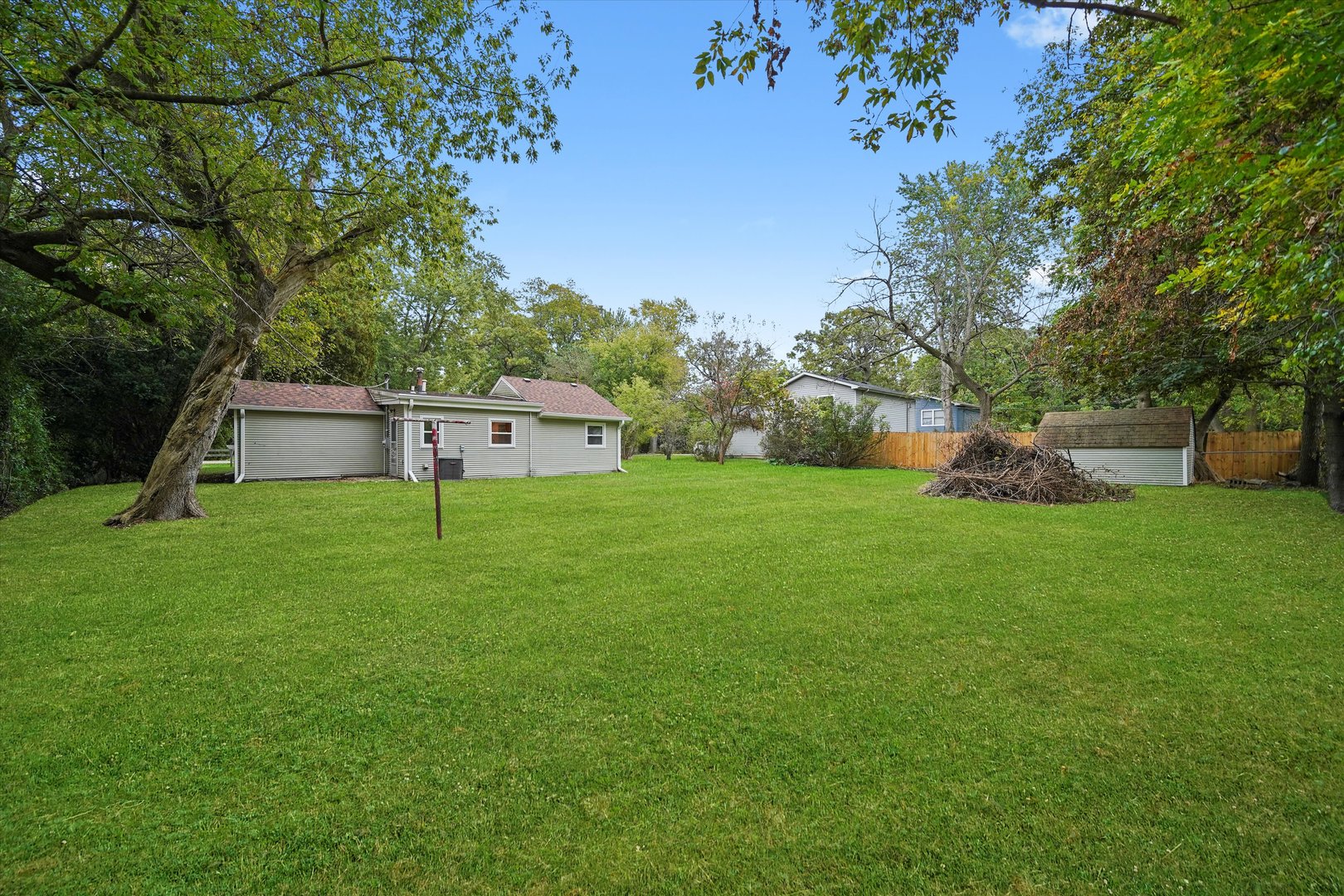 37936 North Wilson Avenue Beach Park, IL 60087 - Photo 14 of 16 a front view of house with a yard and trees