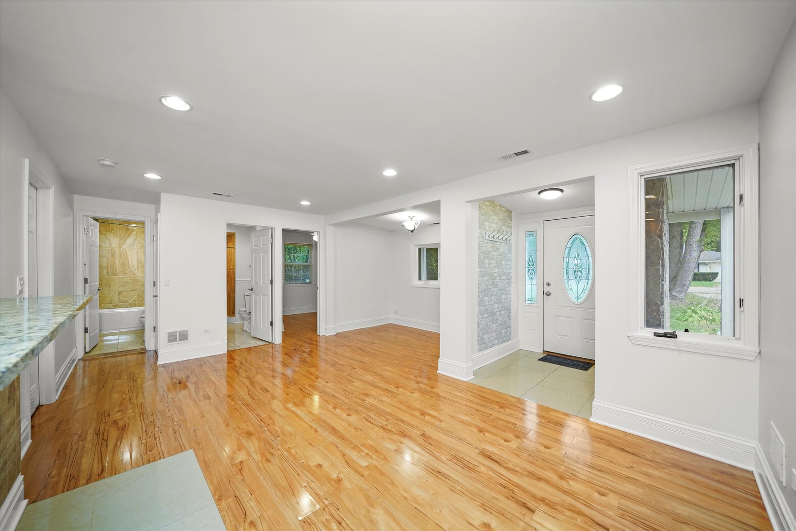 37936 North Wilson Avenue Beach Park, IL 60087 - Photo 4 of 16 a view of an empty room with wooden floor and a window