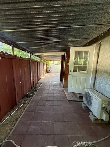 a view of a porch with wooden floor