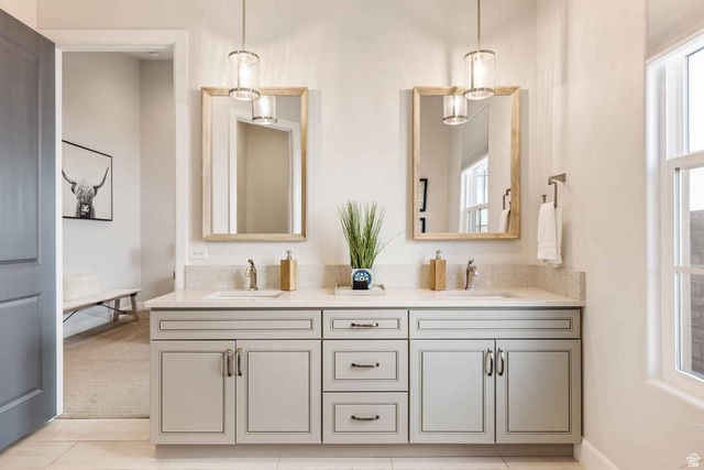 4222 Hampshire Road Hurricane, UT 84737 - Photo 7 of 12 Double vanity featuring light grey cabinetry, dual undermount sinks, and a speckled countertop