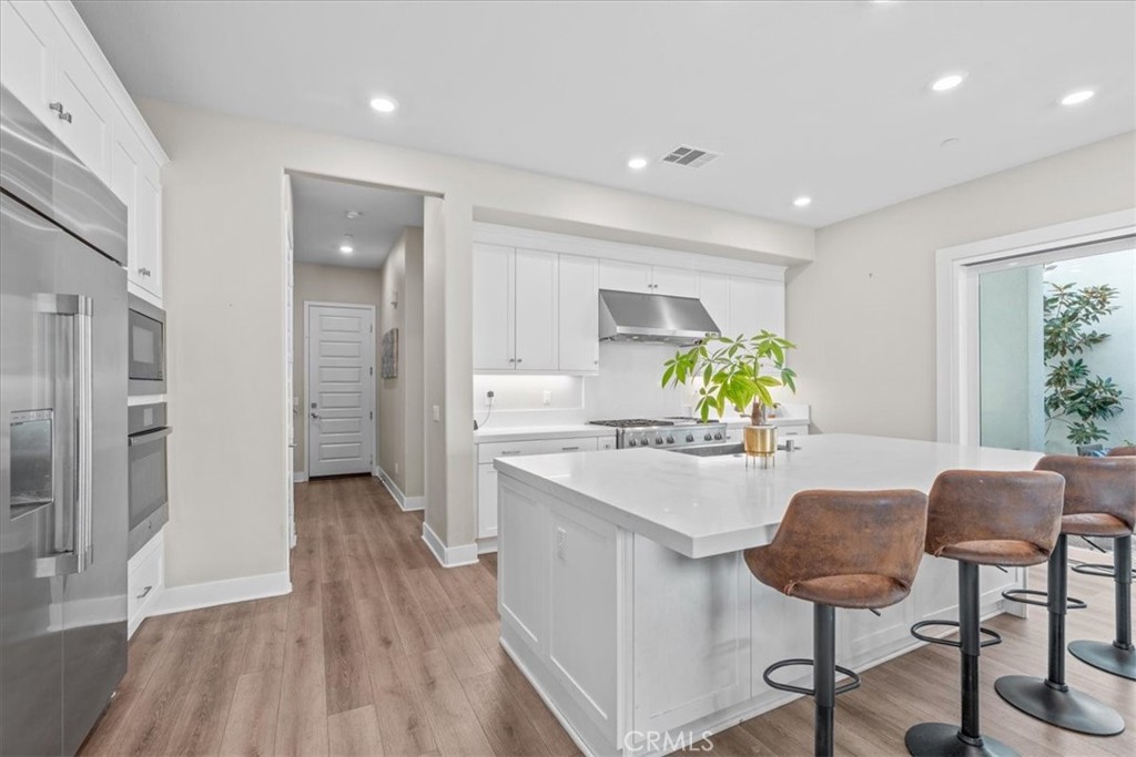113 Source Irvine, CA 92618 - Photo 11 of 39 a view of a kitchen and dining room