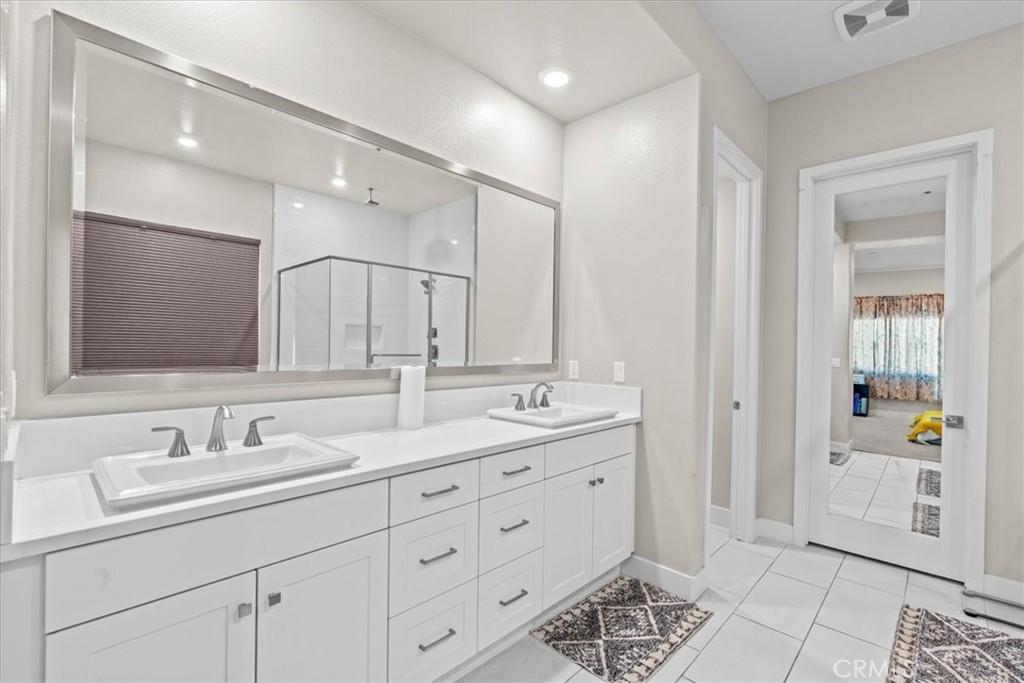 113 Source Irvine, CA 92618 - Photo 20 of 39 a bathroom with double sink and a mirror