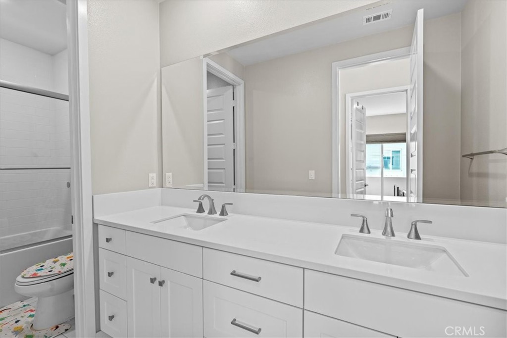 113 Source Irvine, CA 92618 - Photo 25 of 39 a bathroom with a sink and a toilet