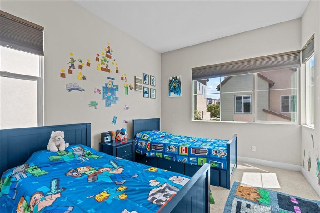113 Source Irvine, CA 92618 - Photo 27 of 39 a bedroom with baby bed toys and paintings on the wall