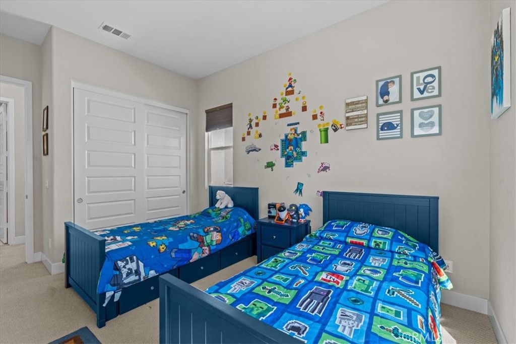 113 Source Irvine, CA 92618 - Photo 28 of 39 a bedroom with two beds and a dresser