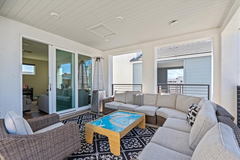 113 Source Irvine, CA 92618 - Photo 29 of 39 a living room with furniture and a large window
