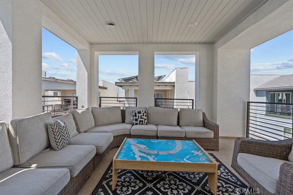 113 Source Irvine, CA 92618 - Photo 30 of 39 a living room with furniture and a rug