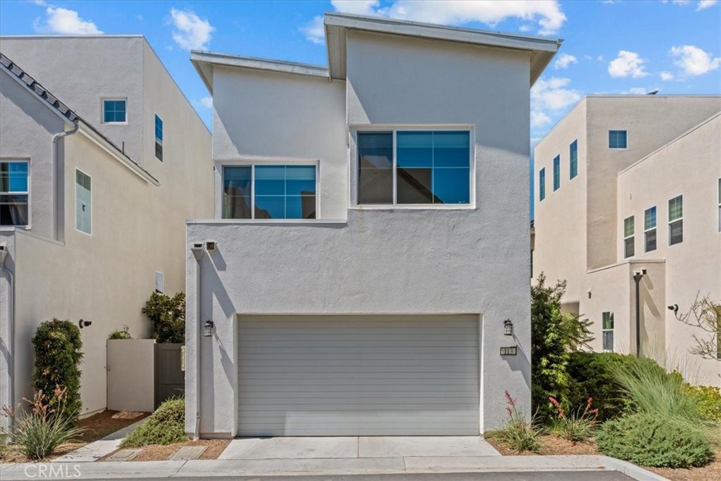 113 Source Irvine, CA 92618 - Photo 3 of 39 a front view of a house with plants