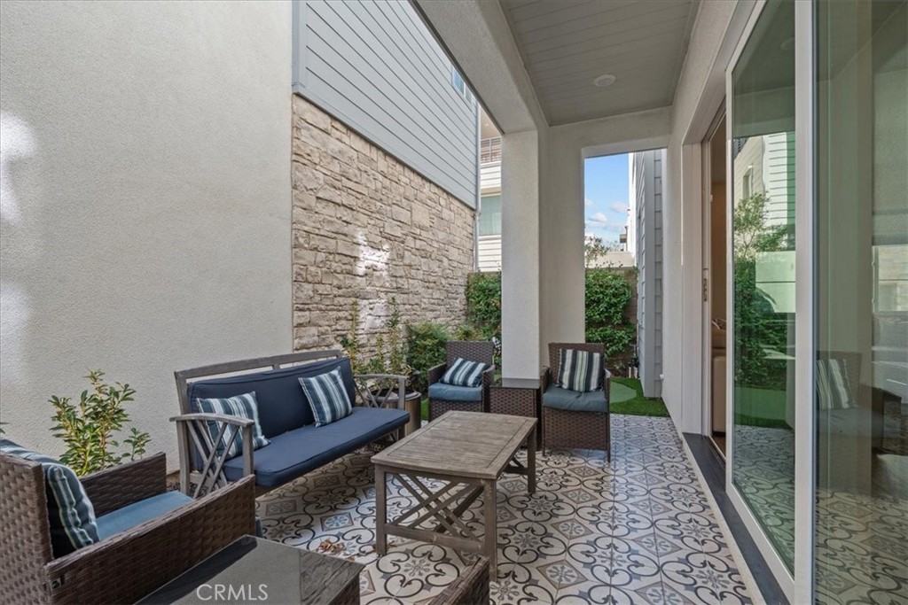 113 Source Irvine, CA 92618 - Photo 33 of 39 a living room with furniture and a rug
