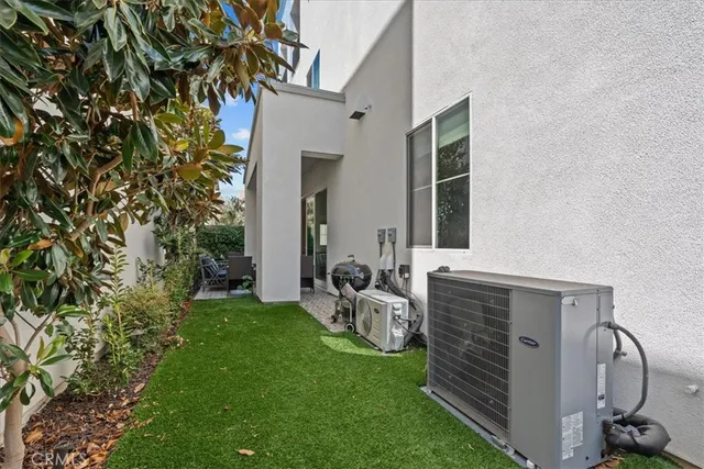 a view of two chairs in the patio
