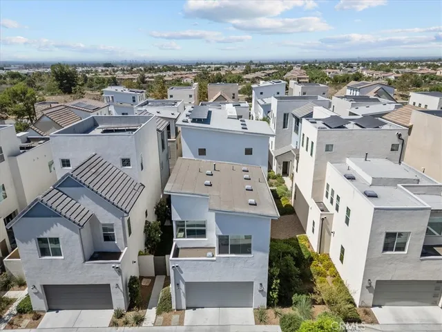an aerial view of a house with a ocean view