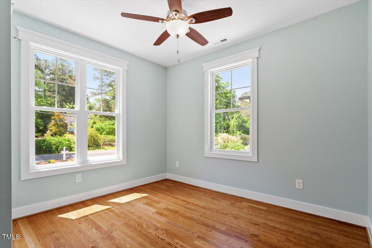 3932 Old Chapel Hill Road Durham, NC 27707 - Photo 30 of 46 a view of an empty room with wooden floor and a window