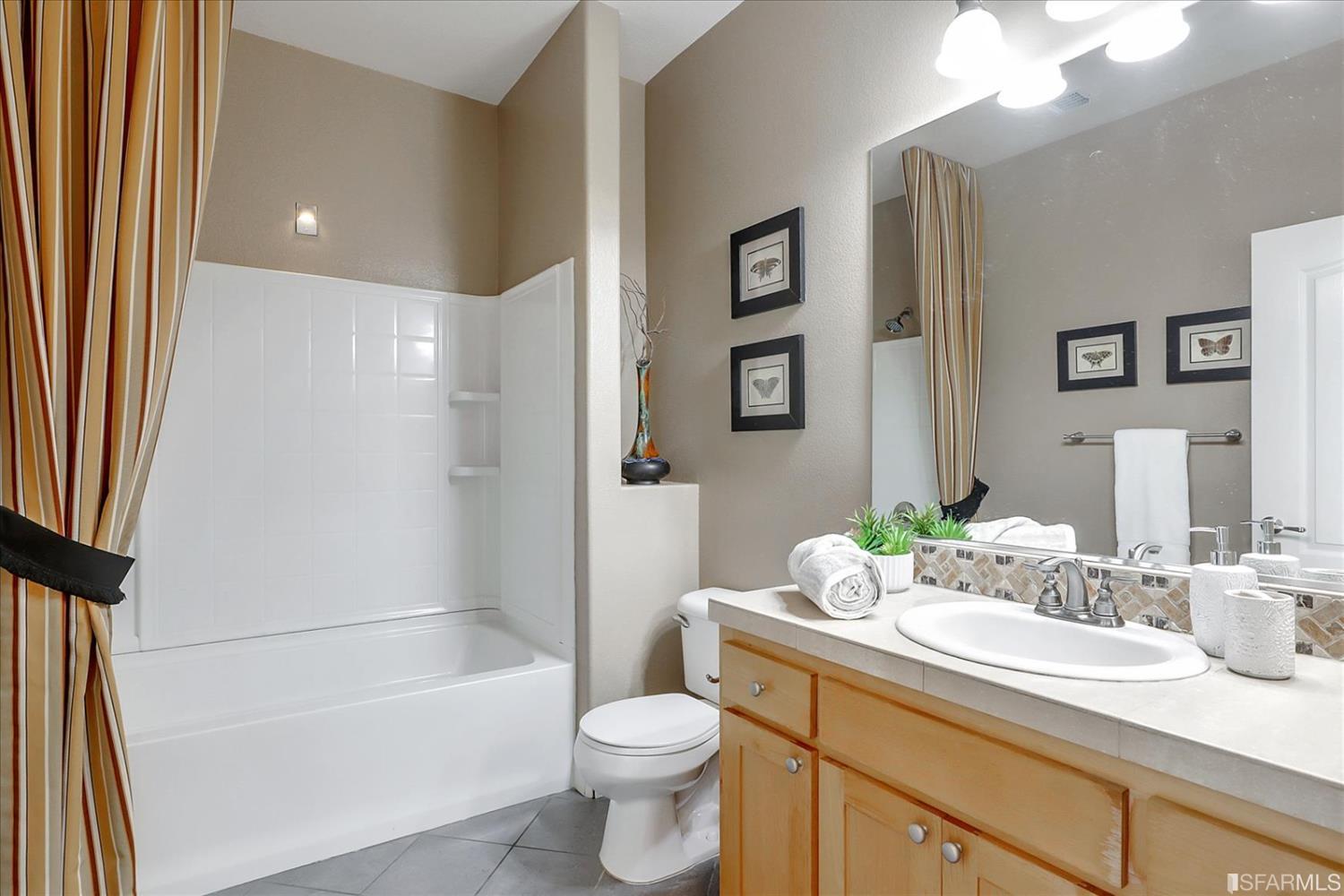 6010 Old Quarry Loop Oakland, CA 94605 - Photo 18 of 32 a bathroom with a sink a toilet and shower